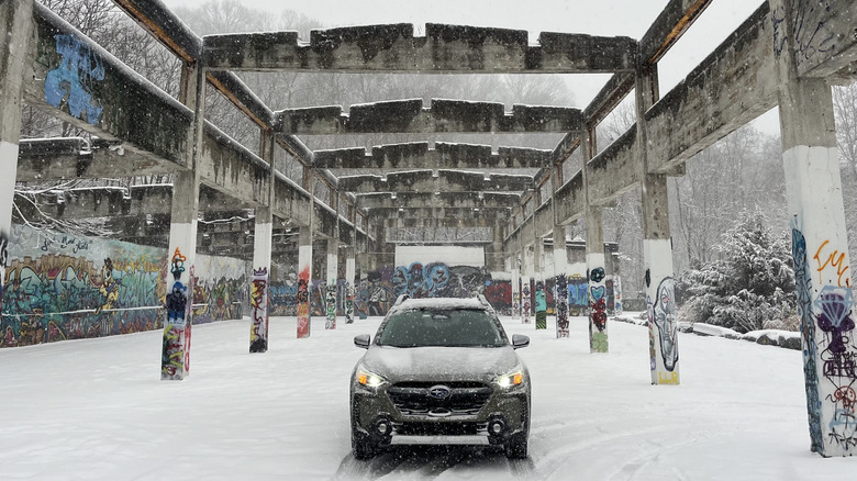 Wide shot Subaru Outback in the snow