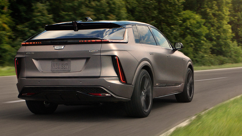 Rear 3/4 view of 2026 Cadillac Lyriq-V driving on road