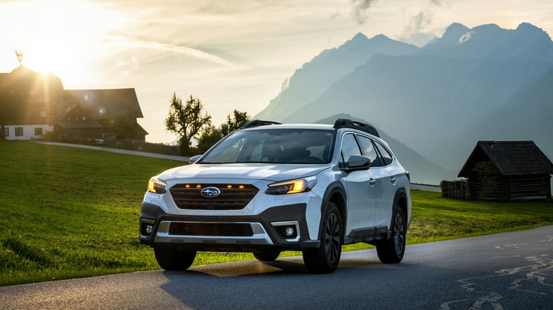 White Outback Subaru in mountain town