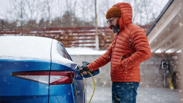 Man charging vehicle