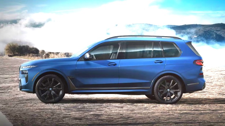 Blue 2025 BMW X7 M60i parked outdoors