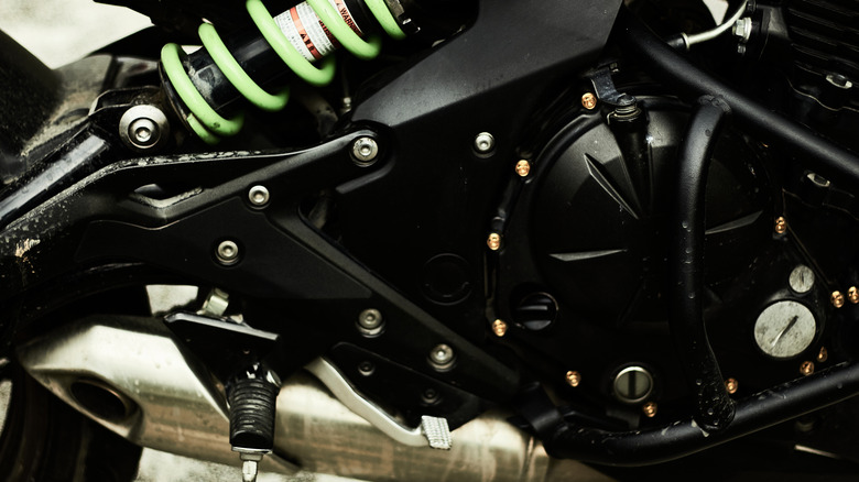 close up of Kawasaki engine with green coil