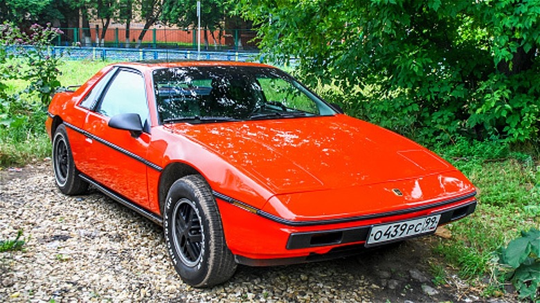 shiny red Pontiac Fiero