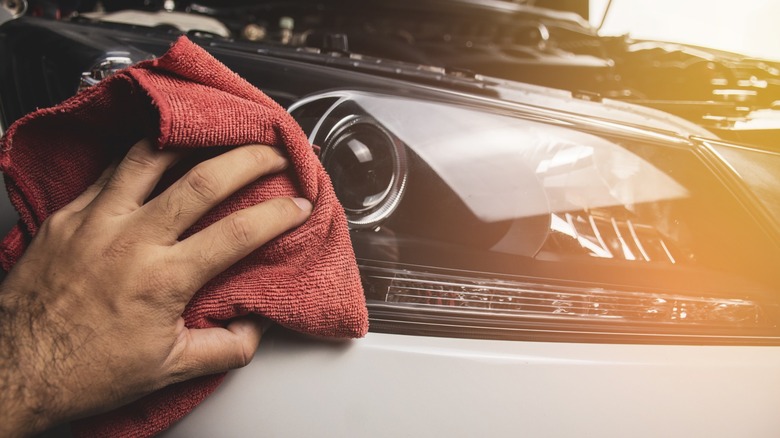 Polishing headlight with microfiber towel