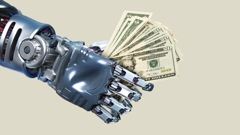 robot arm holding cash