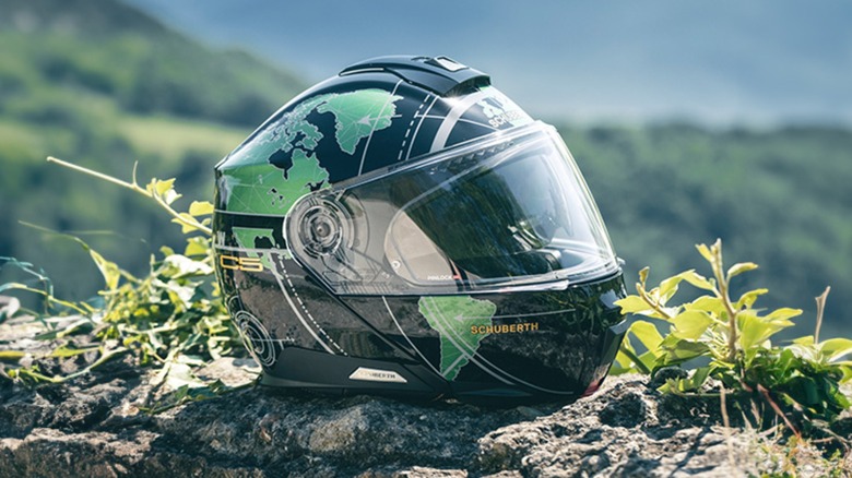 The Schuberth C5 helmet sitting on a rock outside