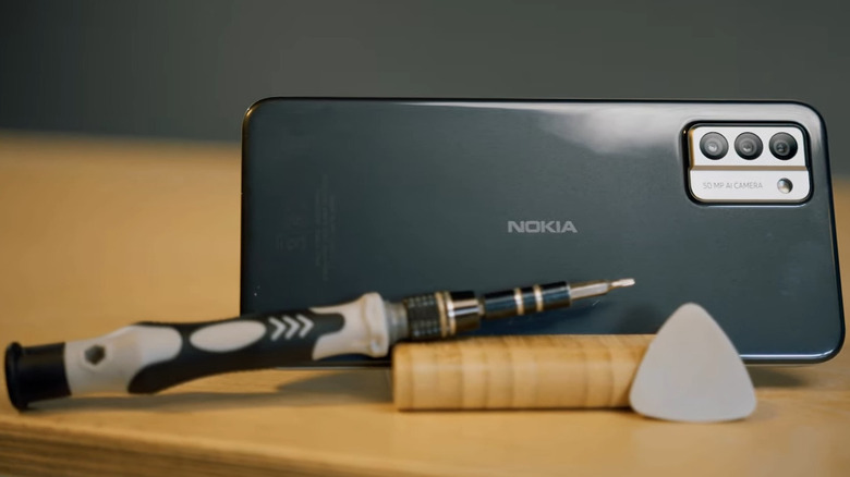 Nokia G22 with tool