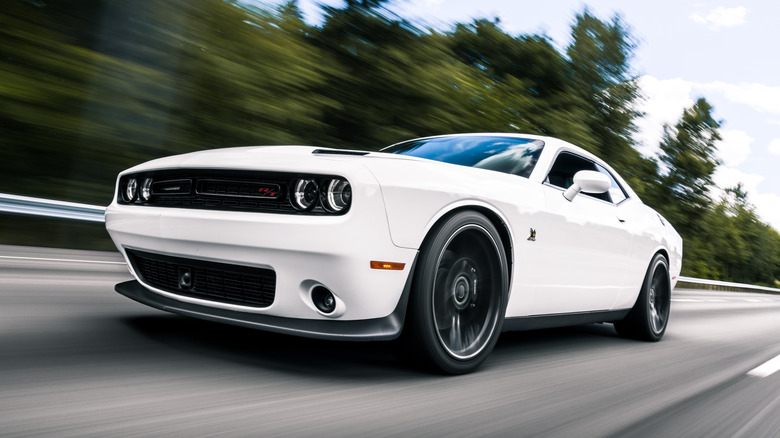 Dodge Charger driving down a road