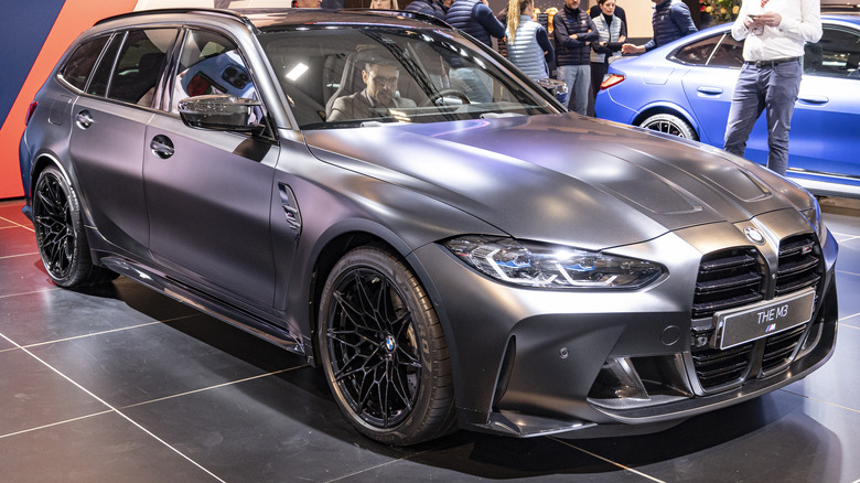 BMW M3 Touring on display, front 3/4 view