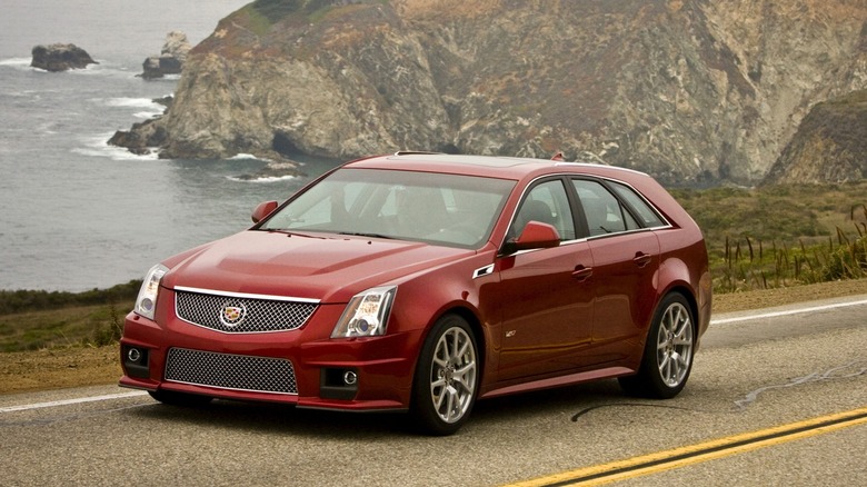 Red Cadillac CTS-V Sport Wagon static, front 3/4 view