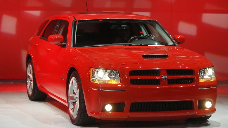 Red Dodge Magnum SRT8 in studio, front 3/4 view