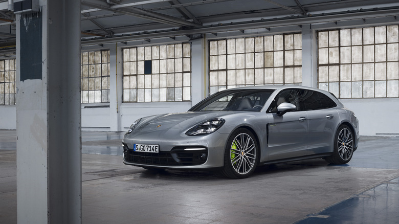 Black Porsche Panamera Turbo S E-Hybrid Sport Turismo static, front 3/4 view