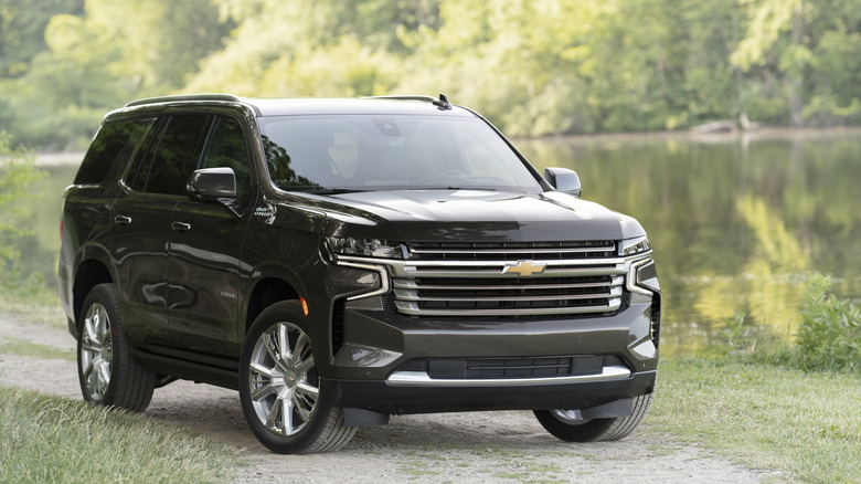 black Chevy Tahoe High Country by lake