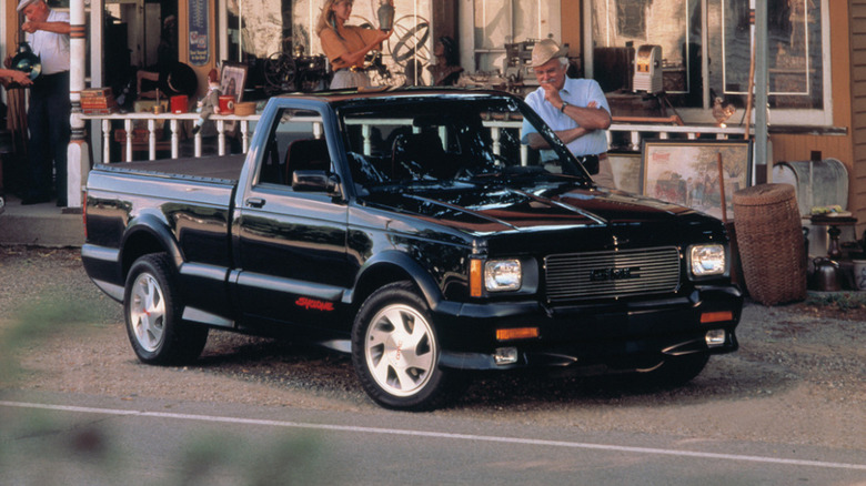 1991 GMC Syclone pickup truck parked in front of general store