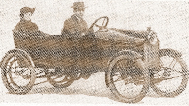 An old photograph of a Merz Cycle Car with driver and passenger