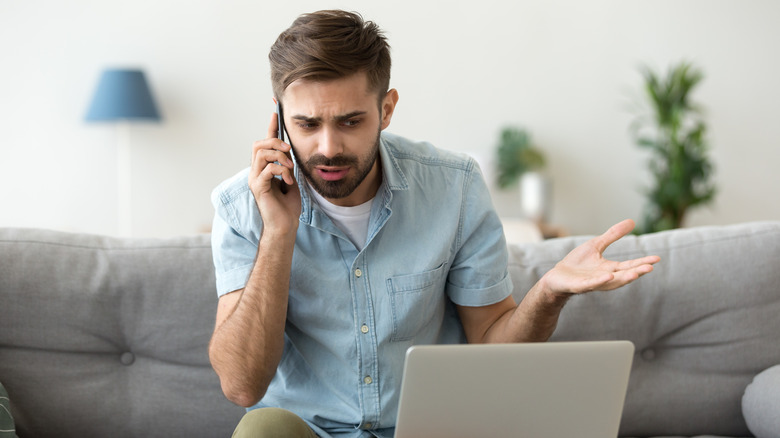 frustrated man waiting for customer support