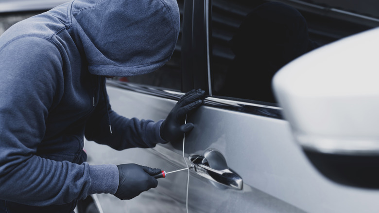 Thief breaking into van