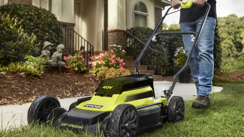 Ryobi push mower on grass