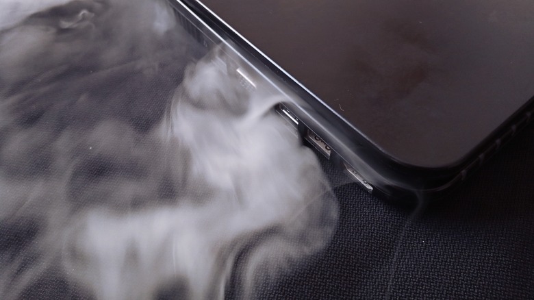 laptop smoking from the side