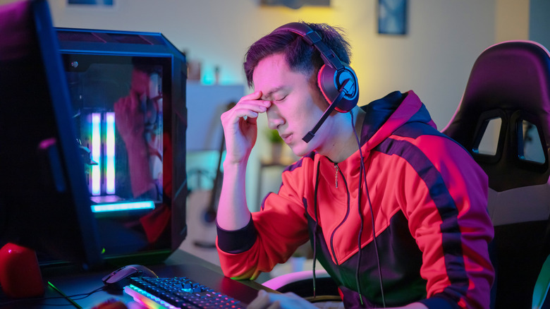 frustrated man sitting at desk