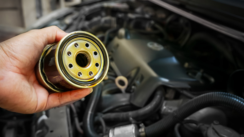 person holding diesel filter