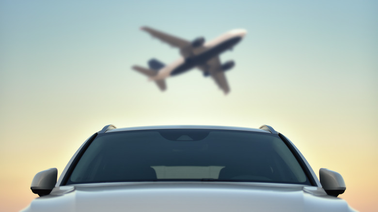 A passenger plane and a car in a single frame