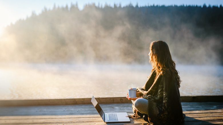 Young woman using a laptop outdoors