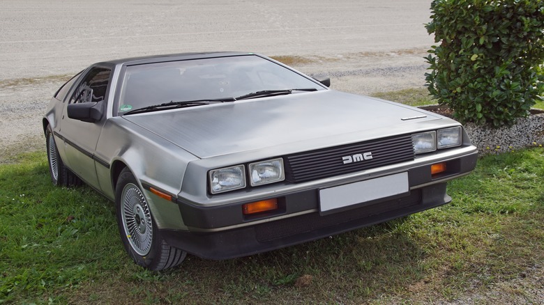 DeLorean DMC-12 parked in grass