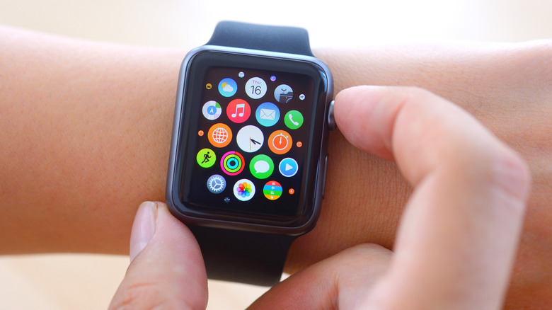 person using Apple Watch on their wrist