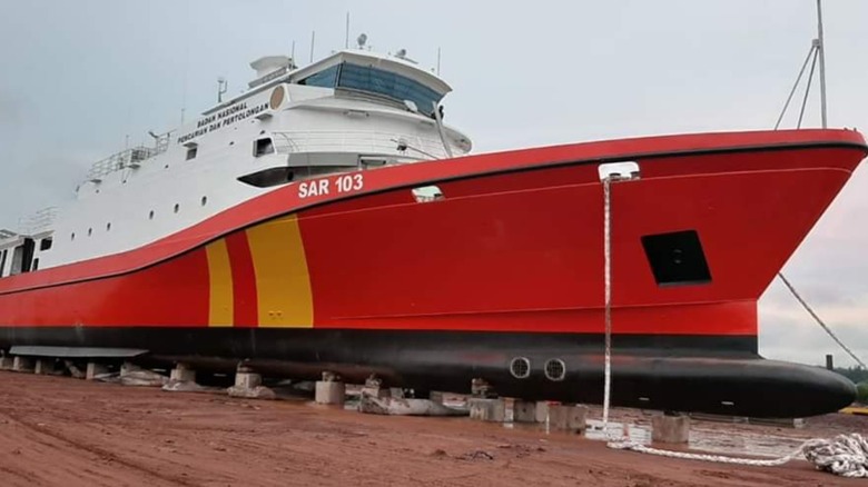 An Indonesian search and rescue vessel is shown on blocks.