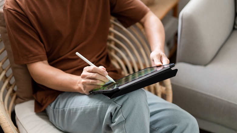 man using iPad