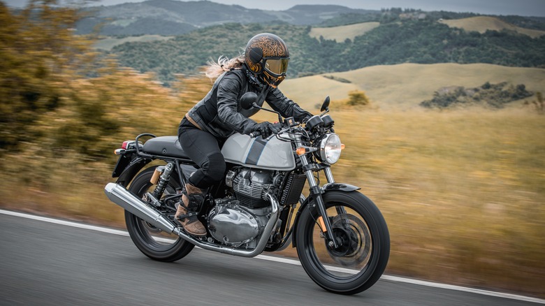 person riding motorcycle in the open road