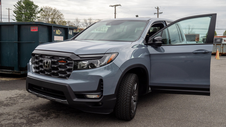 2024 Honda Ridgeline TrailSport parked with driver's side door open