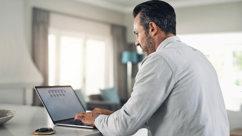 Person typing on laptop