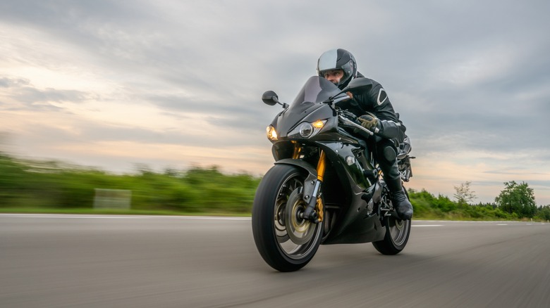 rider staying low on motorcycle