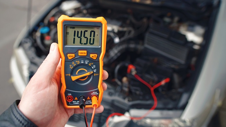 Person using multimeter 