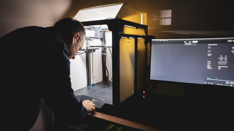 Man using 3D printing software