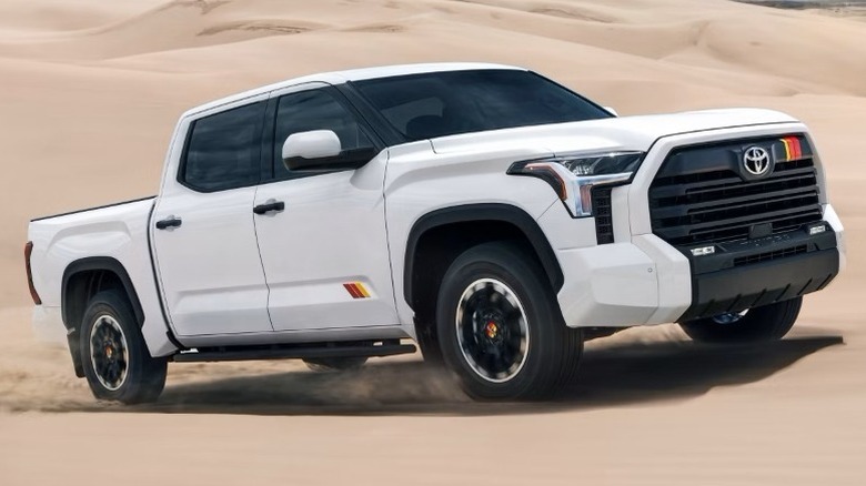 An white Ice Cap Toyota Tundra SR5 CrewMax with TRD Rally Package in the dunes.