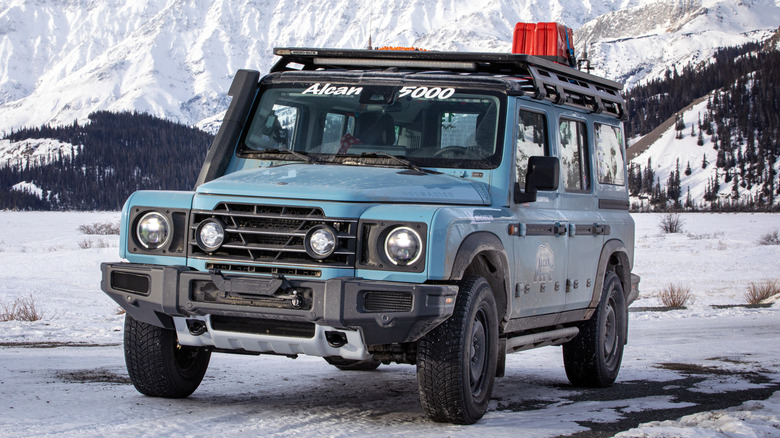 Front 3/4 view of blue Ineos Grenadier in Alcan Rally