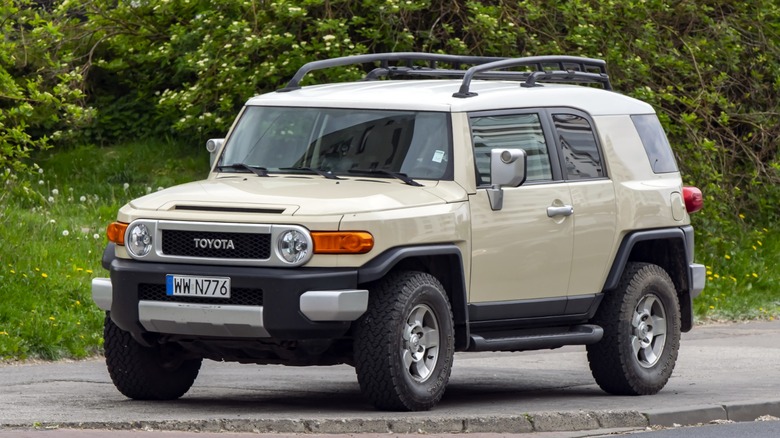 a Toyota FJ Cruiser parked on the sidewalk