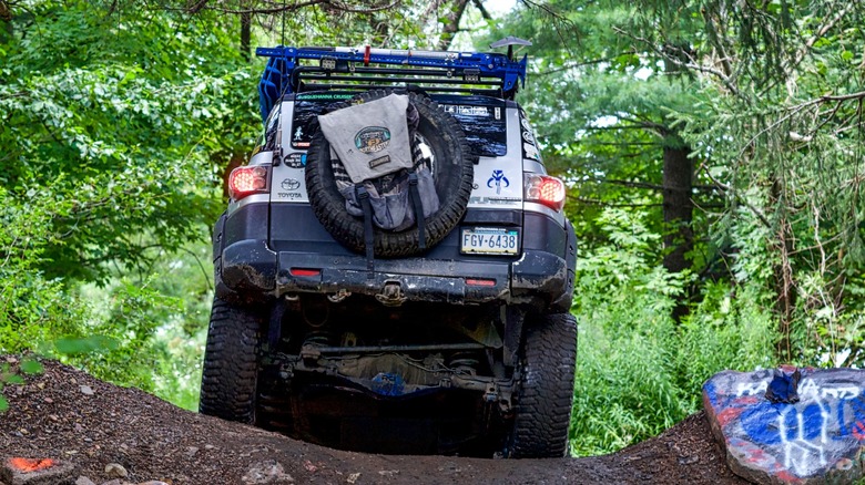 an FJ Cruiser going down an off-road trail