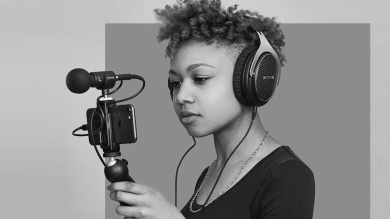 Woman talking into Shure microphone