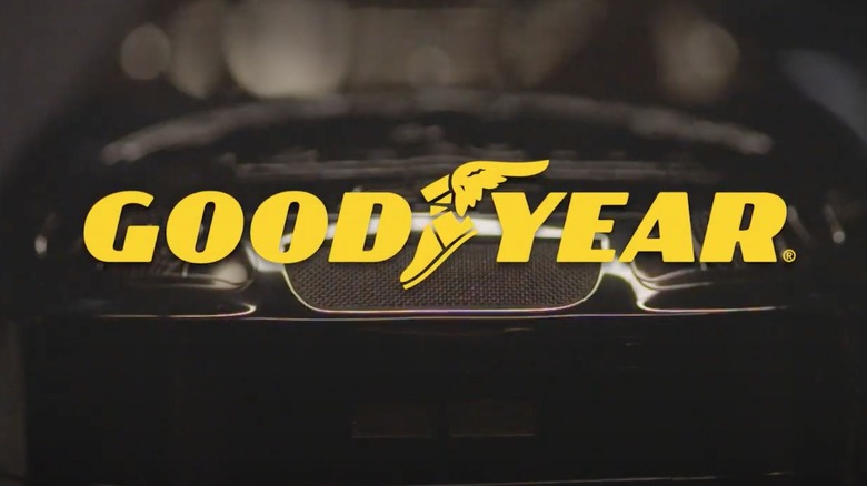 Goodyear Tires logo with vehicle in the background