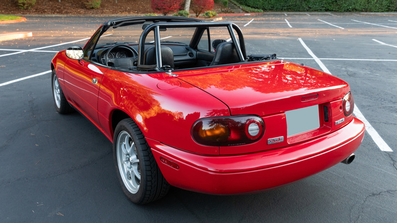 Back of red Miata with top down