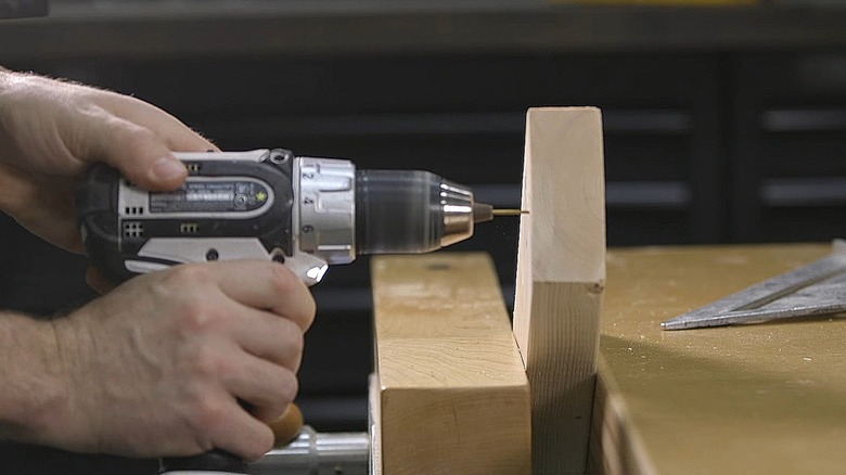 Man Pushing On Power Drill