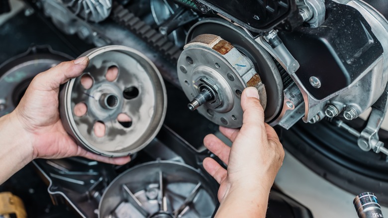 Mechanic servicing transmission parts