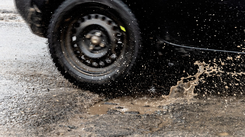 Tire spinning on muddy surface