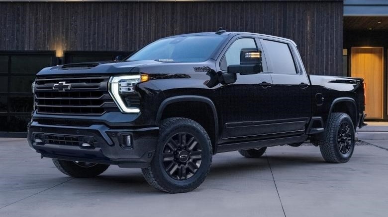 black 2024 Chevy Silverado 2500 HD parked in front of building