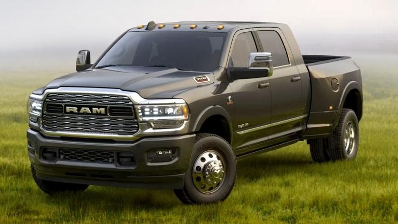 Front 3/4 shot of a 2024 Ram 3500 parked in grass