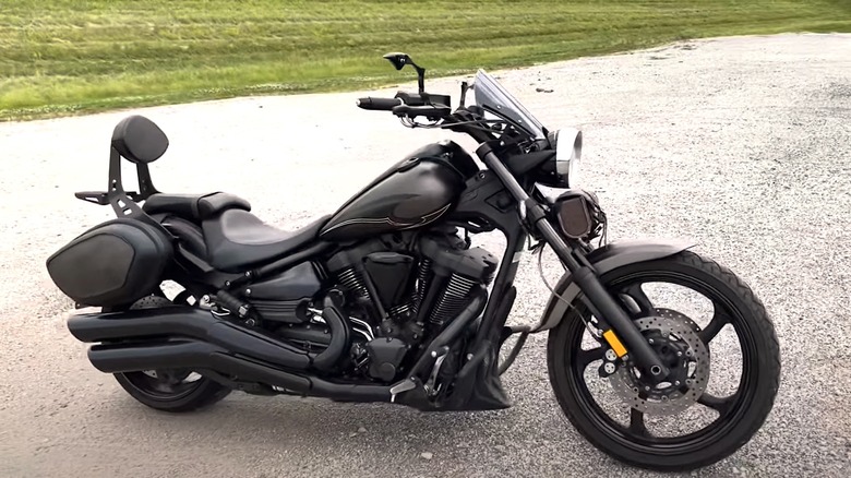 All black Yamaha Raider parked on gravel road